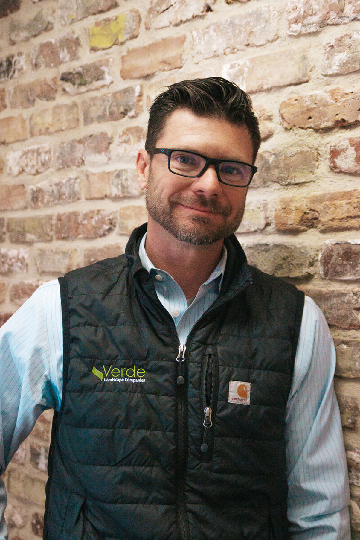 Professional portrait of Ben Thoennes, Owner and General Manager of Verde Landscape, displaying confident leadership qualities in business attire